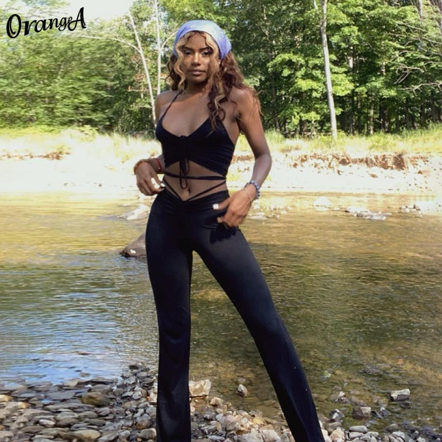 Stretchy black sweatpants from The Clothing Company Sydney, matching with halter bandage v-neck sleeveless tops, stylish clubwear set.
