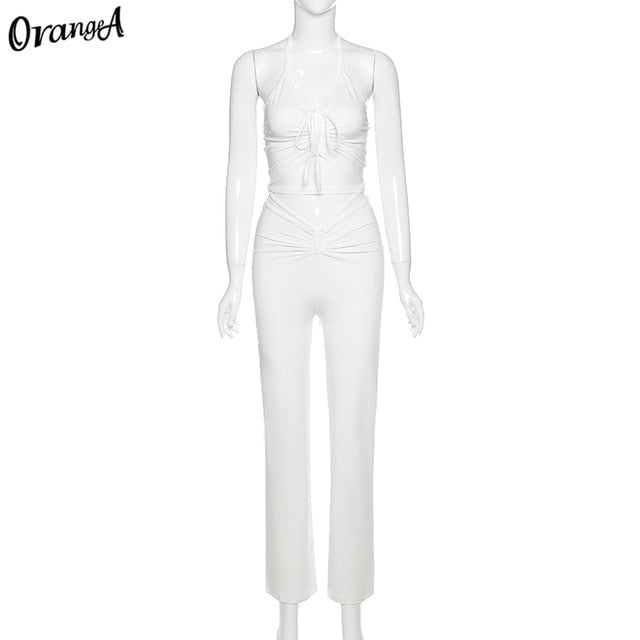 Stretchy black sweatpants from The Clothing Company Sydney, matching 2-piece halter bandage v-neck sleeveless top set.