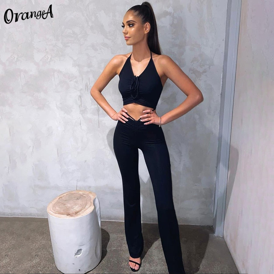 Stretchy black sweatpants from The Clothing Company Sydney, matching with halter bandage v-neck sleeveless tops, casual clubwear set