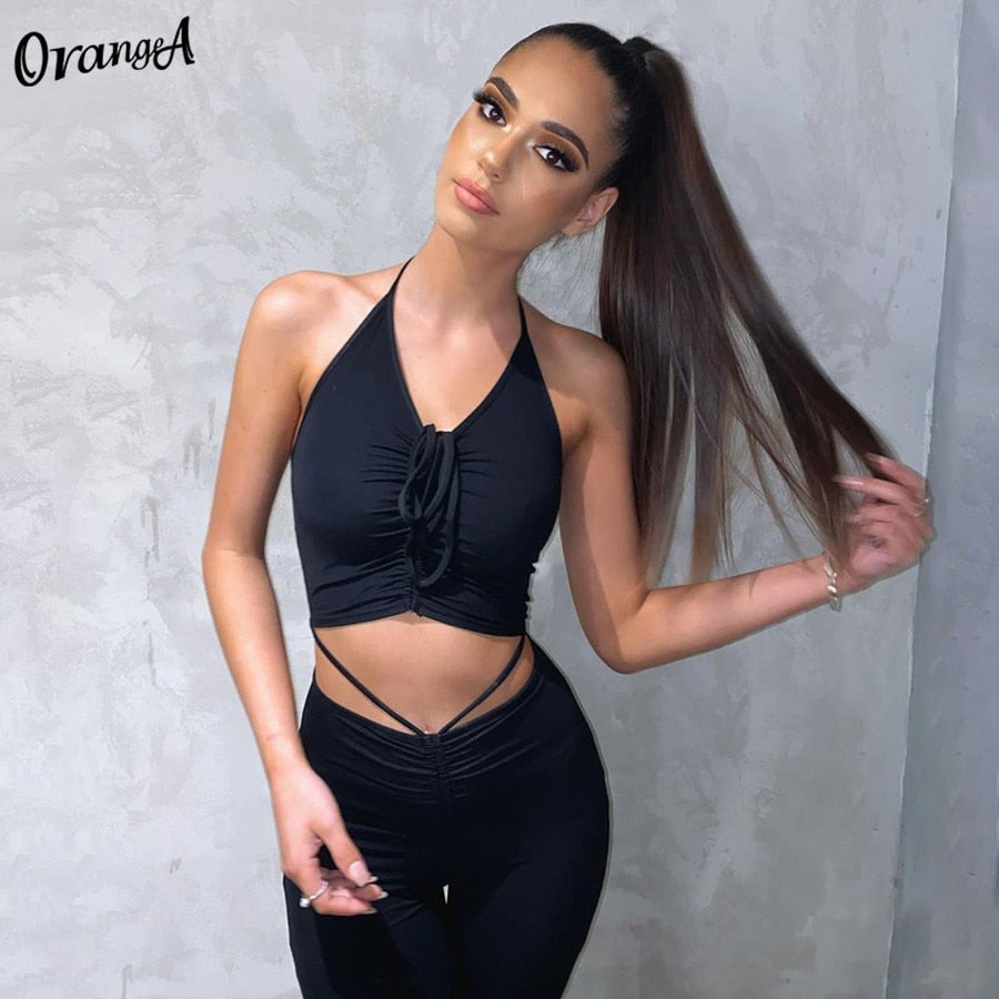 Stretchy black sweatpants from The Clothing Company Sydney, matching with halter bandage v-neck sleeveless tops, slim fit clubwear set.