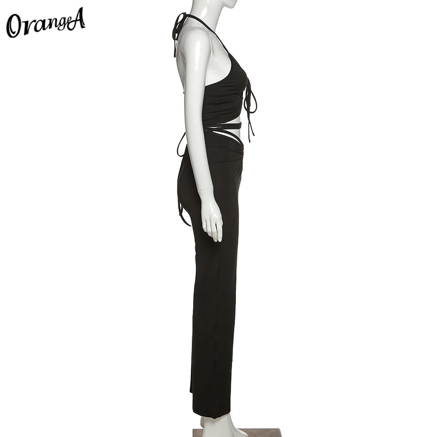 Stretchy black sweatpants from The Clothing Company Sydney, matching with halter bandage v-neck sleeveless tops, slim fit clubwear set.