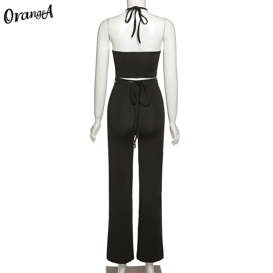 Stretchy black sweatpants from The Clothing Company Sydney, matching with halter bandage v-neck sleeveless tops, bodycon clubwear set.