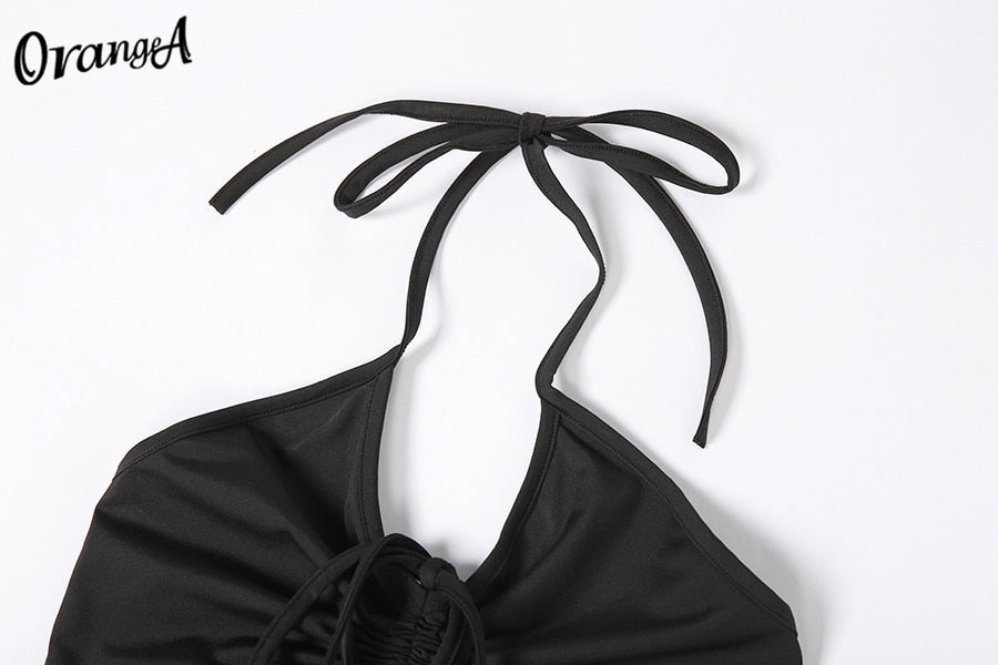Matching black sweatpants from The Clothing Company Sydney with a 2-piece halter bandage v-neck sleeveless ruched top set.