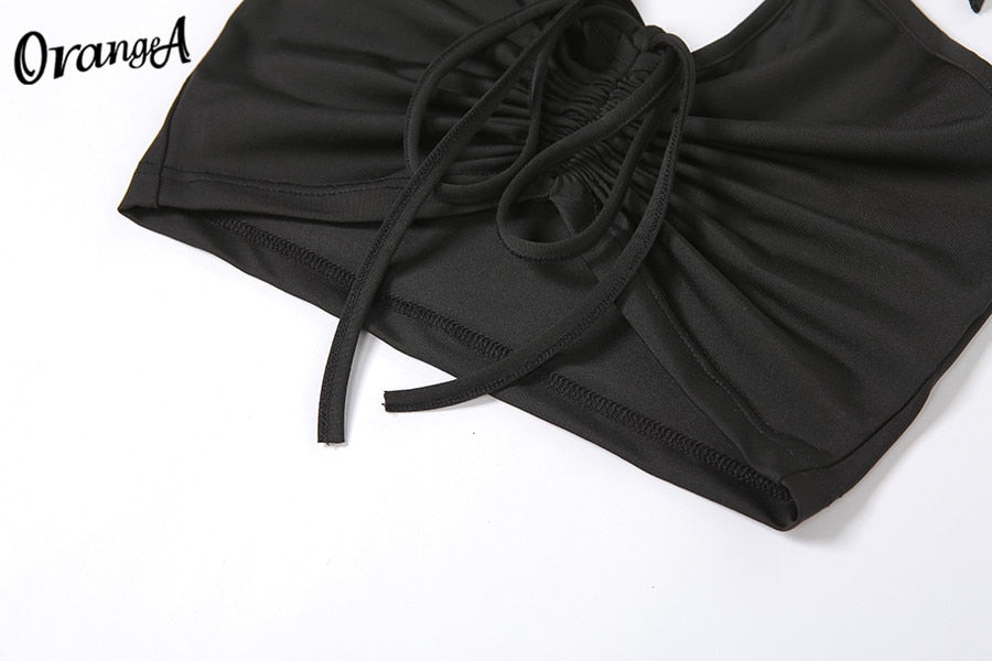 Stretchy black sweatpants from The Clothing Company Sydney, matching halter bandage v-neck sleeveless tops set, bodycon style.