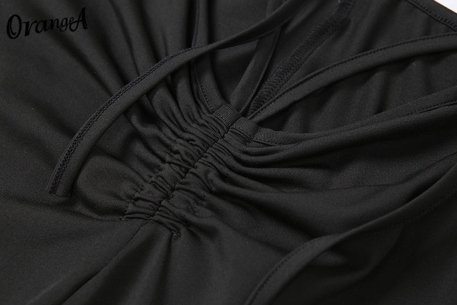 Stretchy black sweatpants from The Clothing Company Sydney, matching with halter bandage v-neck sleeveless tops in a clubwear style.