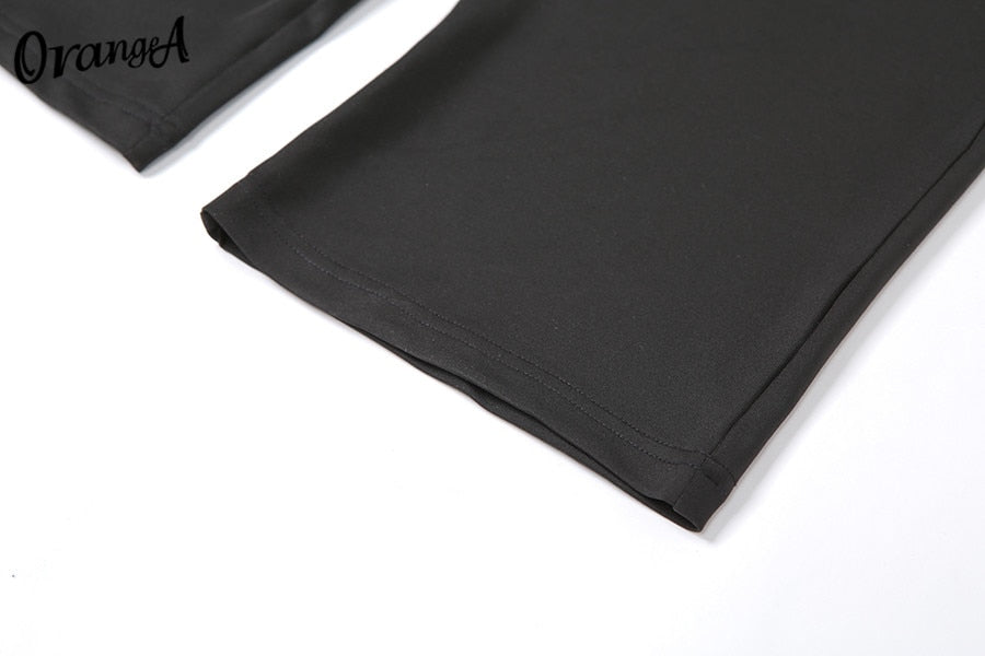 Stretchy black sweatpants from The Clothing Company Sydney, matching halter bandage v-neck sleeveless tops set, slim-fit and ruched design.