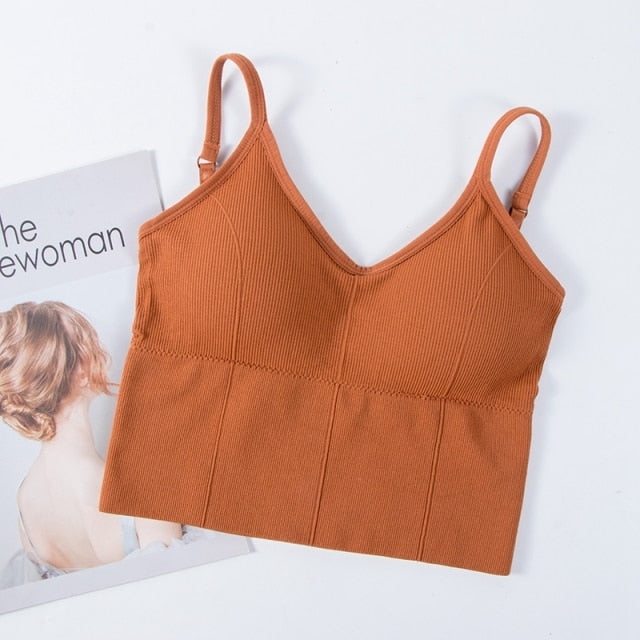 Backless bralette from The Clothing Company Sydney featuring seamless, padded, wireless design with adjustable straps and cotton fabric.