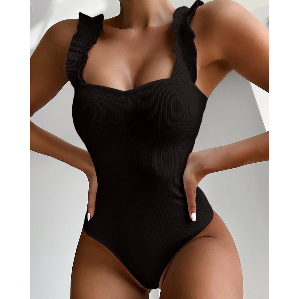 Vintage one-piece ruffled push-up swimwear by The Clothing Company Sydney featuring solid color, padded bust, and stylish monokini design.