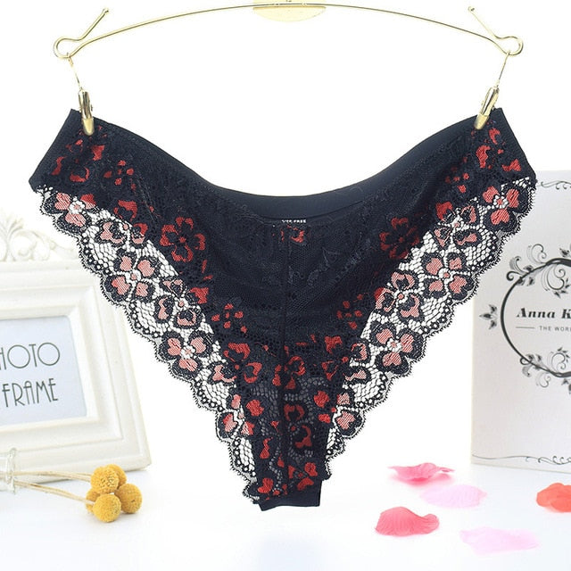 Low-waist floral embroidered lace thong from The Clothing Company Sydney, featuring transparent T-back design and delicate detailing.