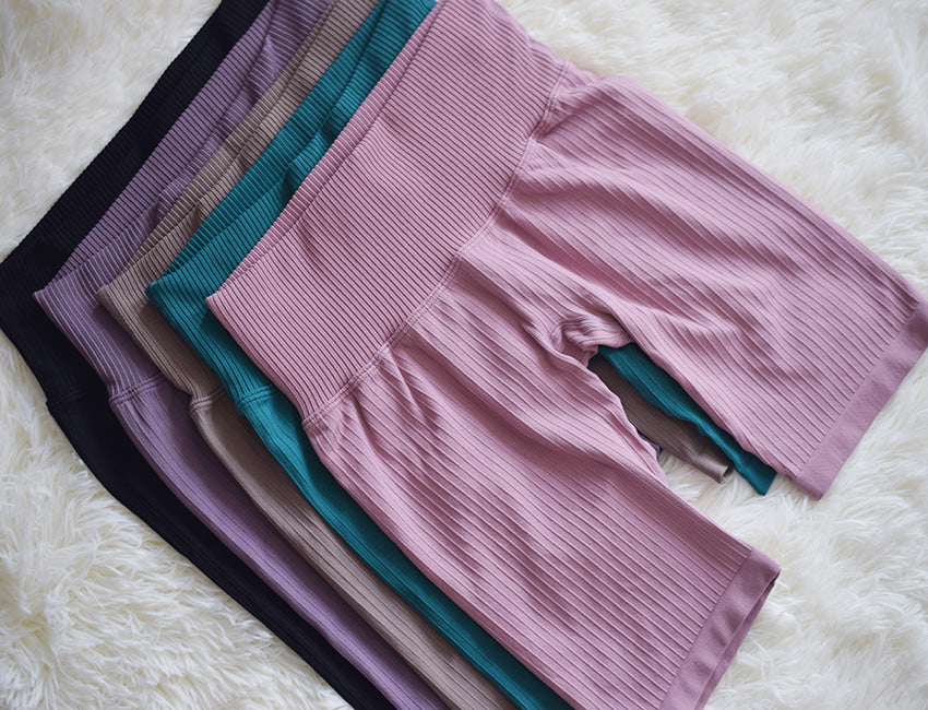 High-waist seamless yoga shorts and biker leggings from The Clothing Company Sydney, perfect for fitness and outdoor sports.