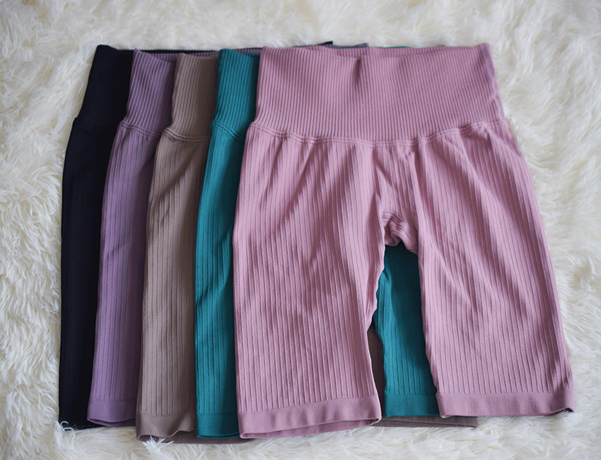 High waist seamless yoga shorts and biker leggings in a fitness set by The Clothing Company Sydney, suitable for outdoor or gym workouts.