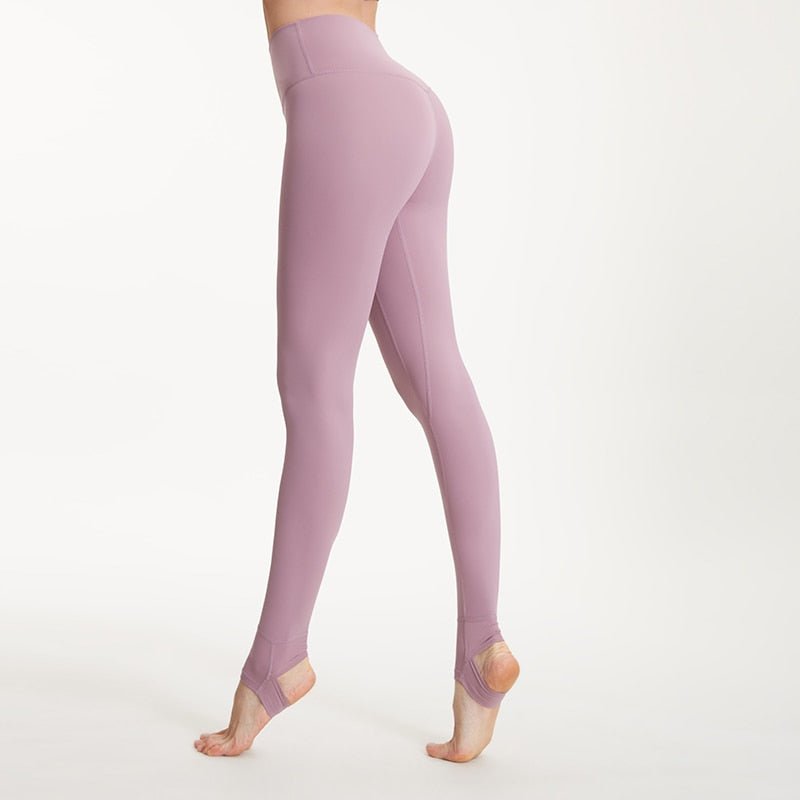 Women's high waist fitness yoga pants with stirrup design from The Clothing Company Sydney, ideal for running and gym workouts.