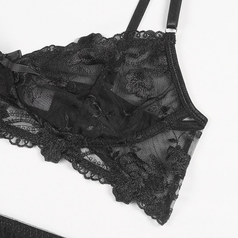 Transparent lace push-up bra set with garters and thong, featuring embroidery and see-through design from The Clothing Company Sydney.