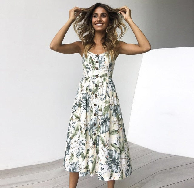 Vintage casual sundress from The Clothing Company Sydney with polka dots, stripes, floral patterns, midi length, backless, and button details.