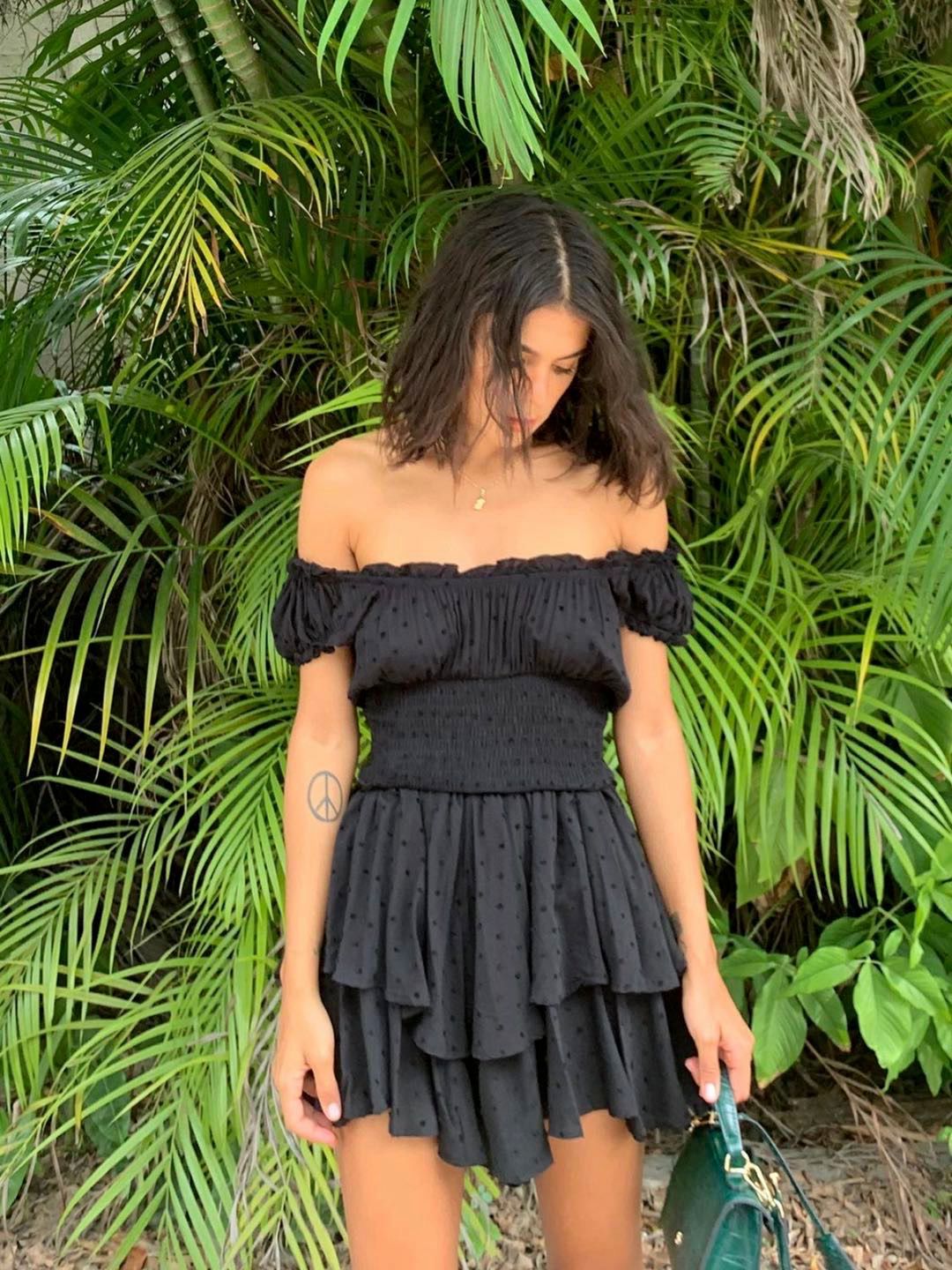 Boho-inspired mini summer dress with shirred ruffled neckline, tiered design, puff sleeves, and rayon fabric from The Clothing Company Sydney.