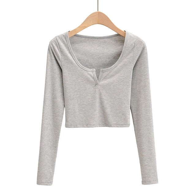White V-neck long sleeve knitted crop top from The Clothing Company Sydney, featuring slim ribbed design and casual style.