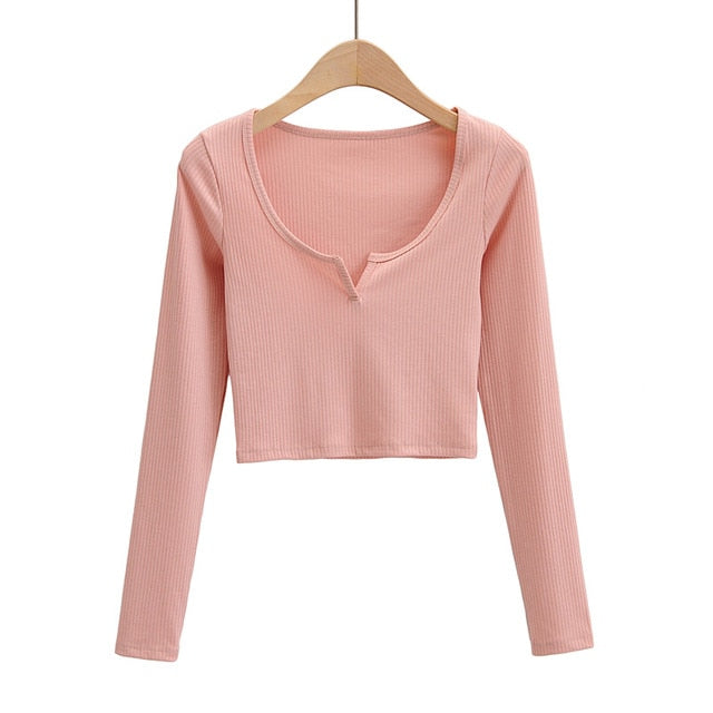 White V-neck long sleeve knitted crop top from The Clothing Company Sydney, featuring slim fit and ribbed texture.
