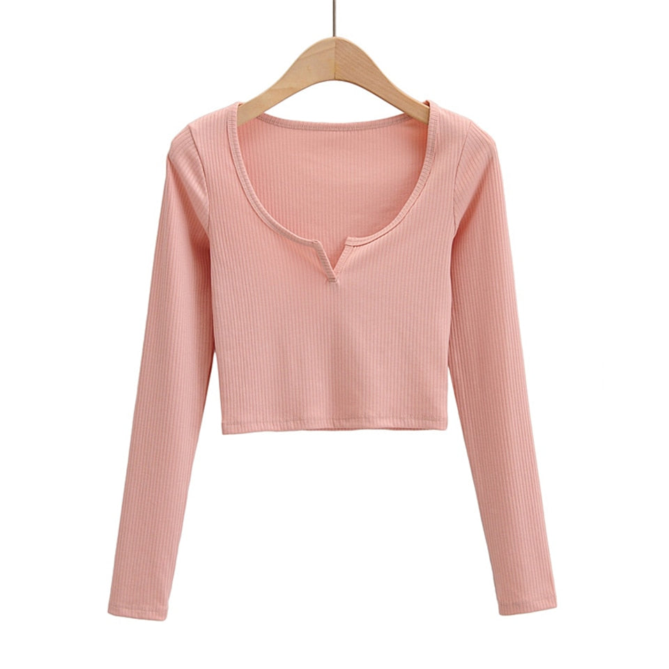 White V-neck long sleeve knitted crop top from The Clothing Company Sydney, featuring slim fit and ribbed fabric details.