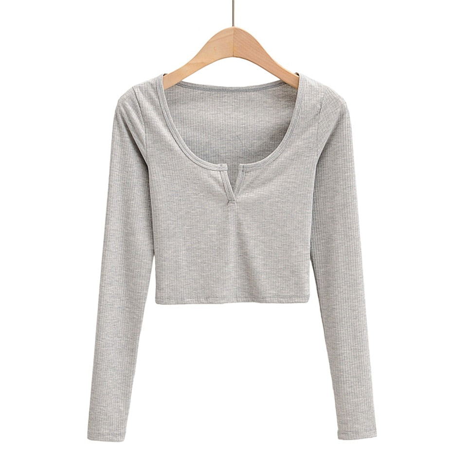 White V-neck long sleeve knitted crop top from The Clothing Company Sydney with slim fit and ribbed texture.