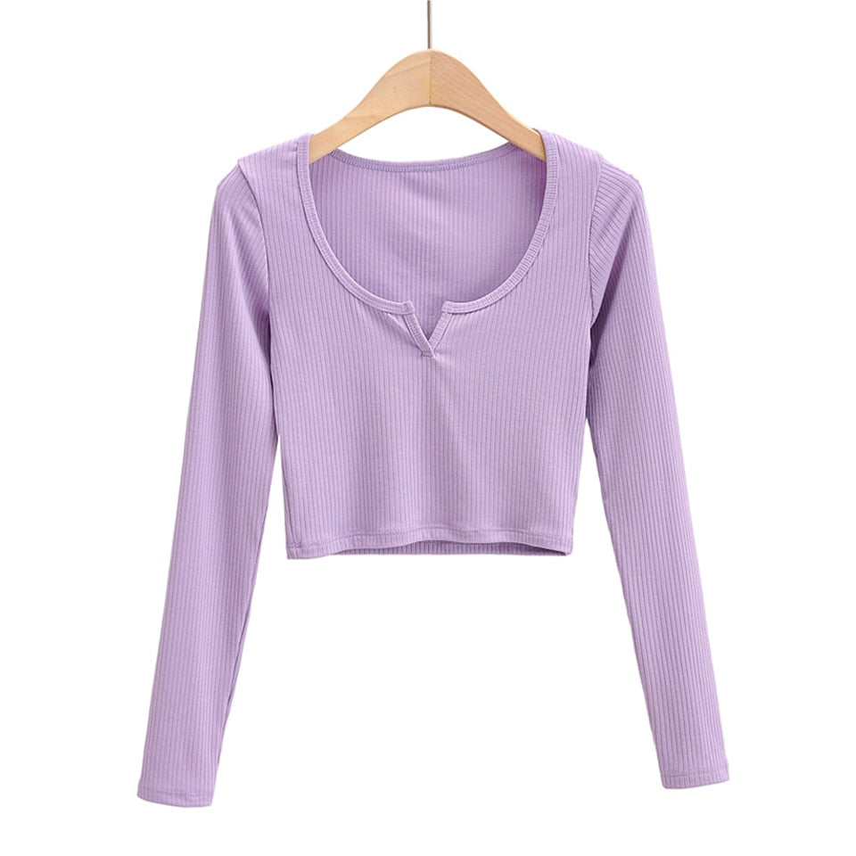 White V-neck long sleeve knitted crop top from The Clothing Company Sydney, featuring slim fit and ribbed texture.