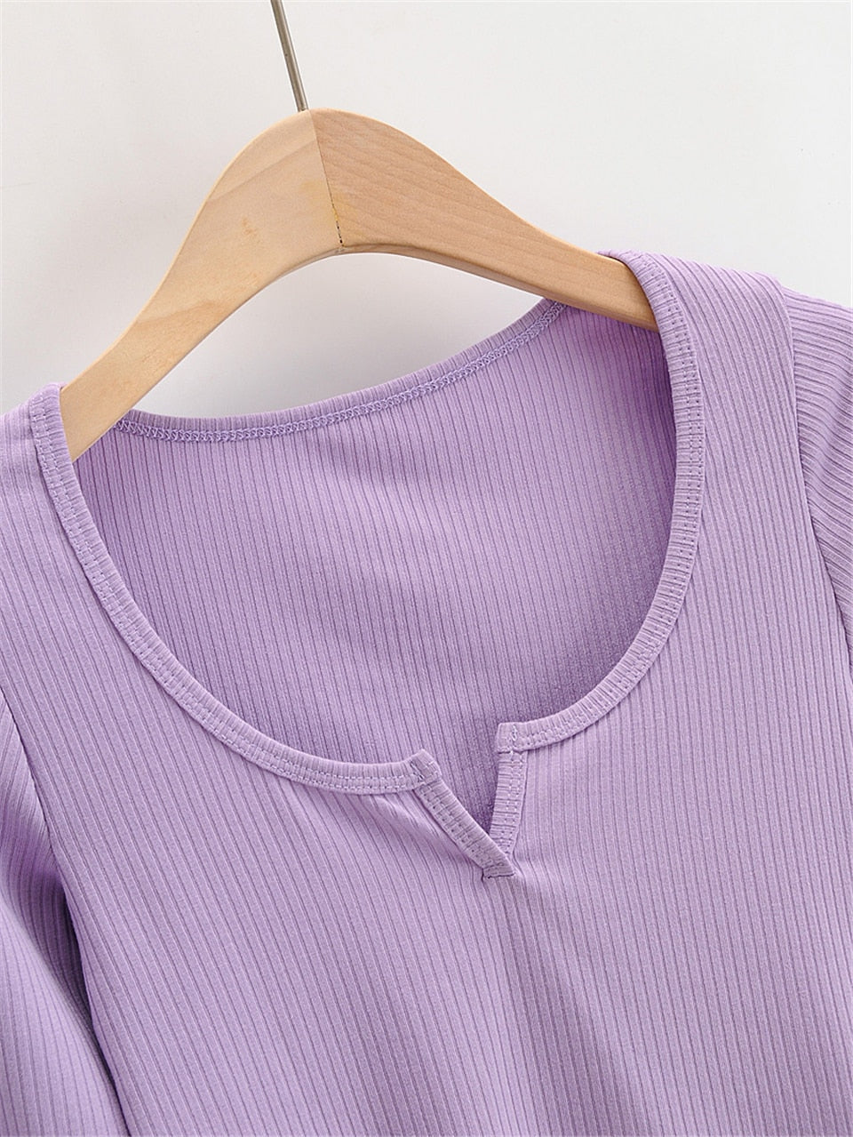 White V-neck long sleeve knitted crop top from The Clothing Company Sydney, slim fit with ribbed texture and casual style.