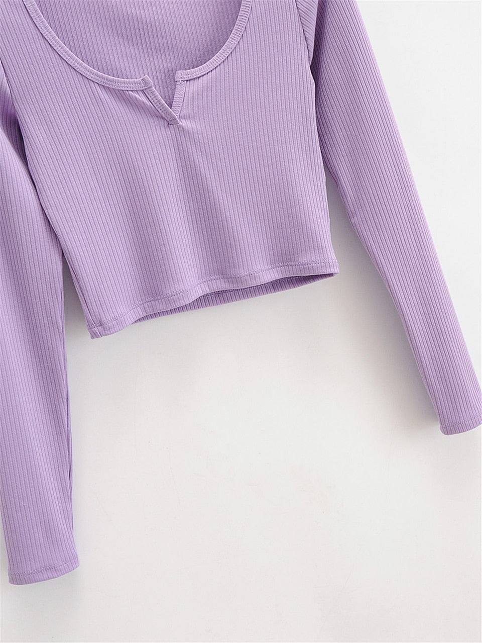 White V-neck long sleeve knitted crop top by The Clothing Company Sydney, slim fit ribbed casual T-shirt with a V neckline.