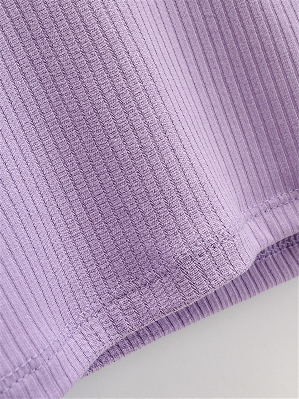 White V-neck long sleeve knitted crop top from The Clothing Company Sydney, featuring slim fit and ribbed texture.