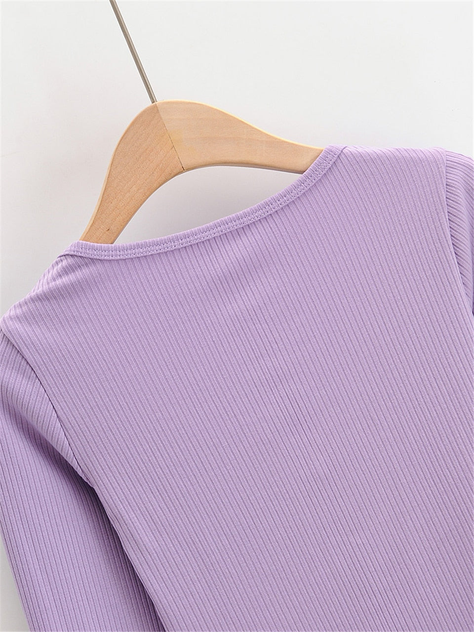 White V-neck long sleeve knitted crop top with slim ribbed design by The Clothing Company Sydney.