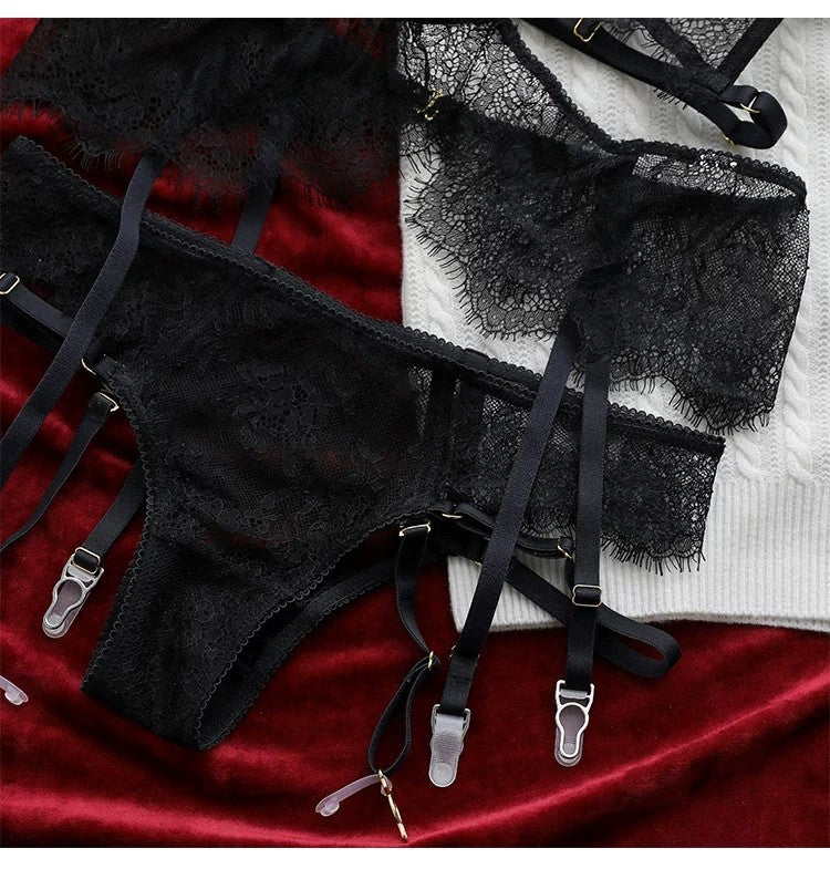 Black halter neck bandage lingerie set with see-through lace bra, thong, and garter belt suspenders from The Clothing Company Sydney.