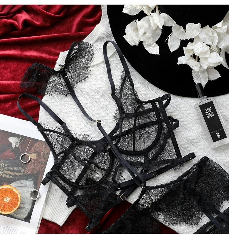 Black lace see-through lingerie set with halter neck bandage bra, thong, and garter belt suspenders from The Clothing Company Sydney