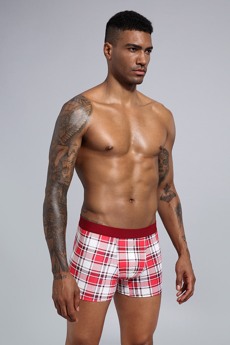 Four-pack men's cotton boxer shorts from The Clothing Company Sydney, showing comfortable trunks laid out flat.