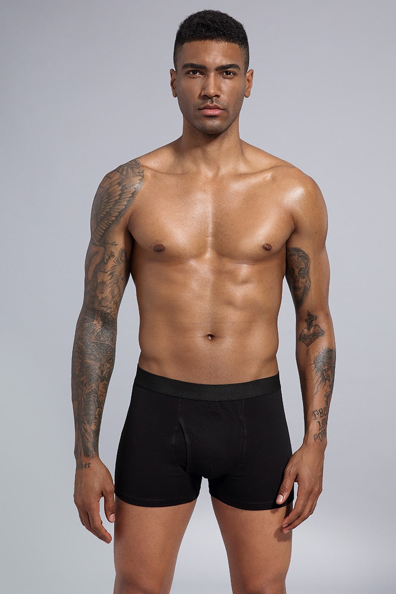Four-pack men's cotton boxer shorts from The Clothing Company Sydney, featuring comfortable, casual underwear trunks and briefs.