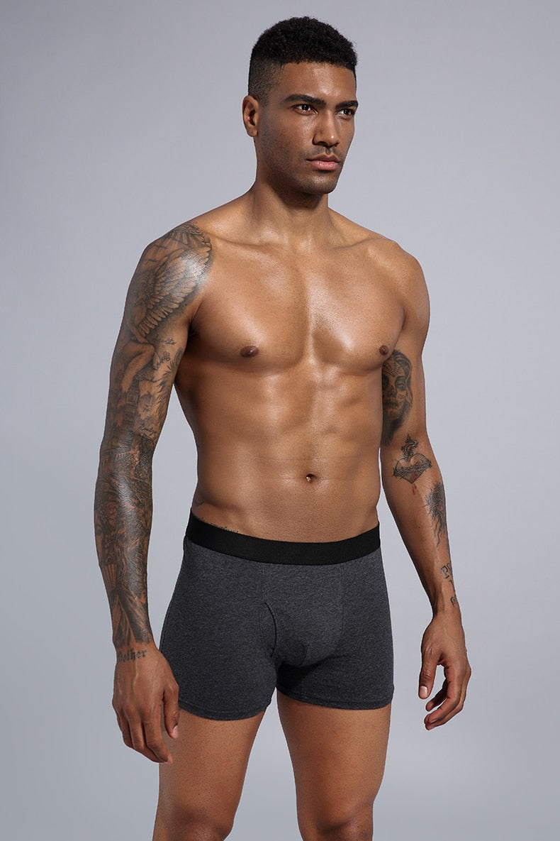 Four men's cotton boxer shorts from The Clothing Company Sydney in a pack, featuring classic trunks design.