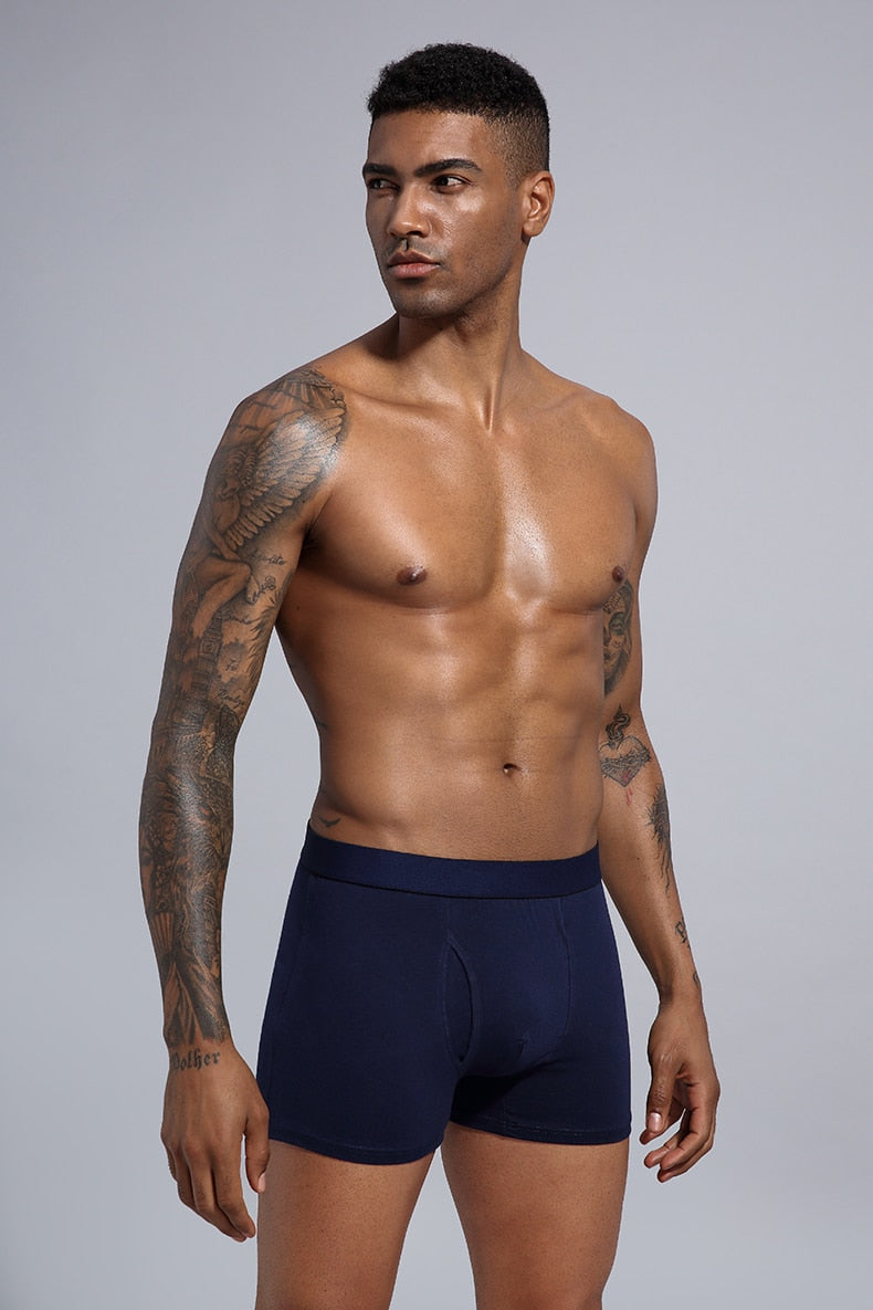 Four men's cotton boxer shorts pack from The Clothing Company Sydney, featuring comfortable trunks and classic boxer briefs.