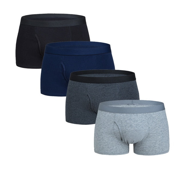 Four men's cotton boxer shorts pack featuring trunks and briefs from The Clothing Company Sydney, displayed in a neat bundle.