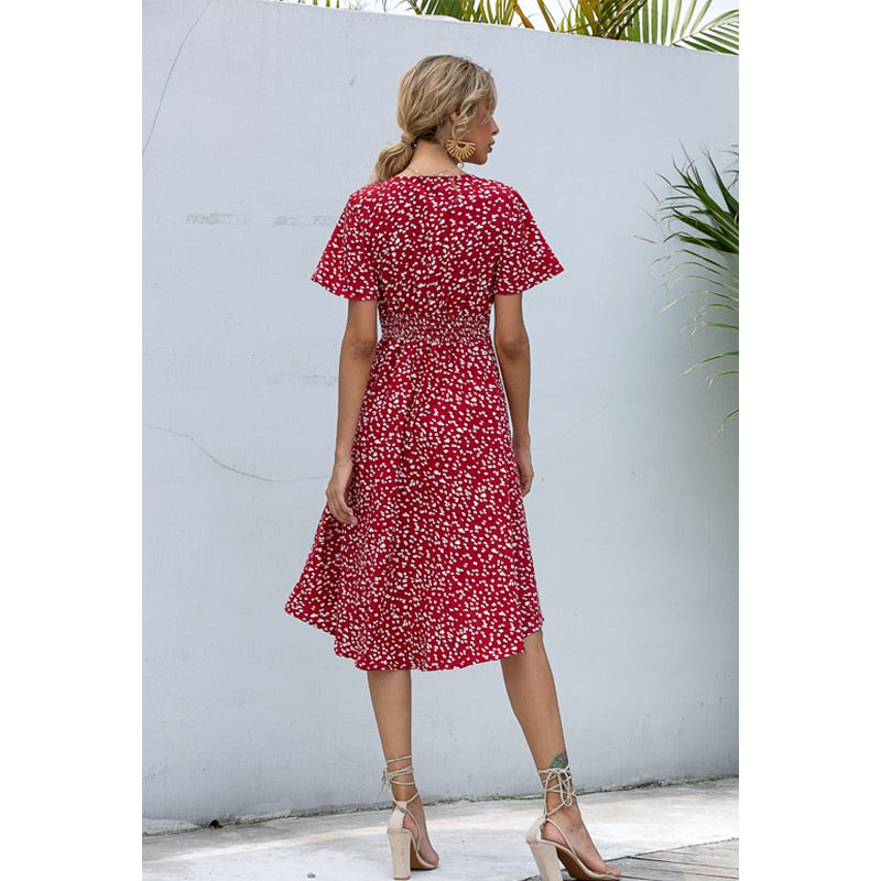 Summer midi dress by The Clothing Company Sydney with V-neck, printed pattern, buttons, high waist, and irregular hem detail.