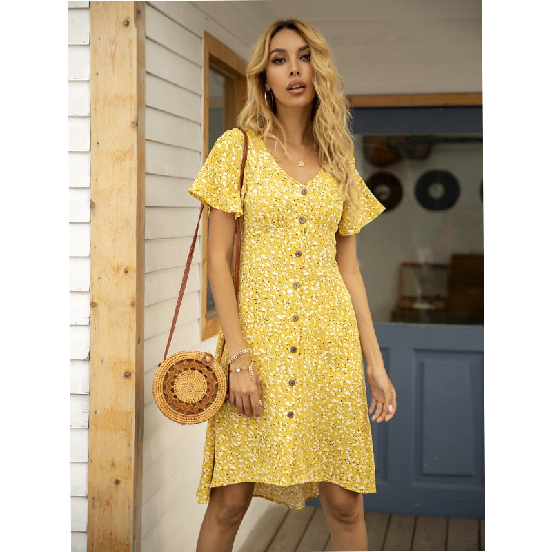 Summer midi dress by The Clothing Company Sydney with V-neck, printed pattern, single row buttons, high waist, and irregular hem.