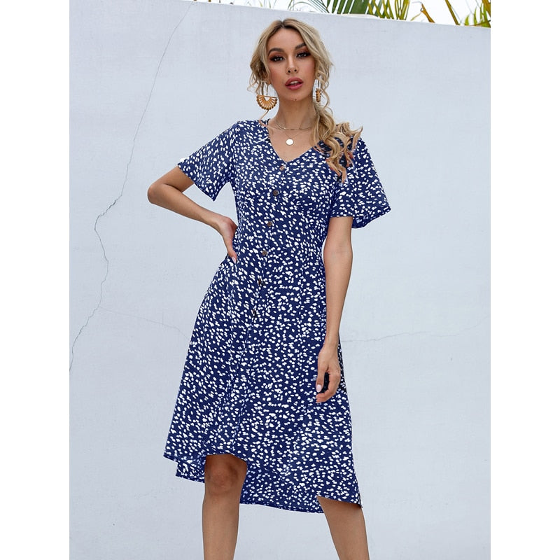 Summer midi dress by The Clothing Company Sydney featuring V-neck, printed fabric, single row buttons, high waist, and irregular hem.