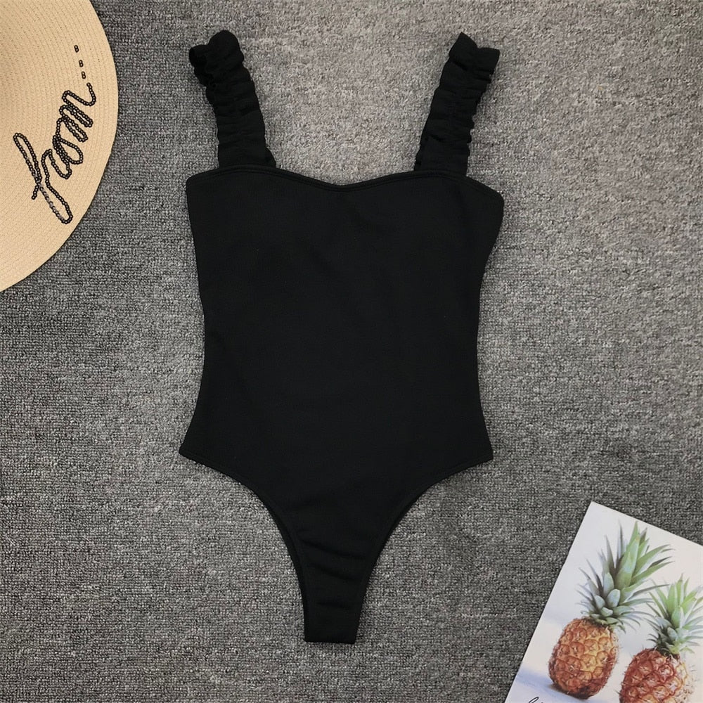 Vintage one-piece ruffled push-up solid swimwear by The Clothing Company Sydney featuring padded monokini bathing suit with stylish ruffles.
