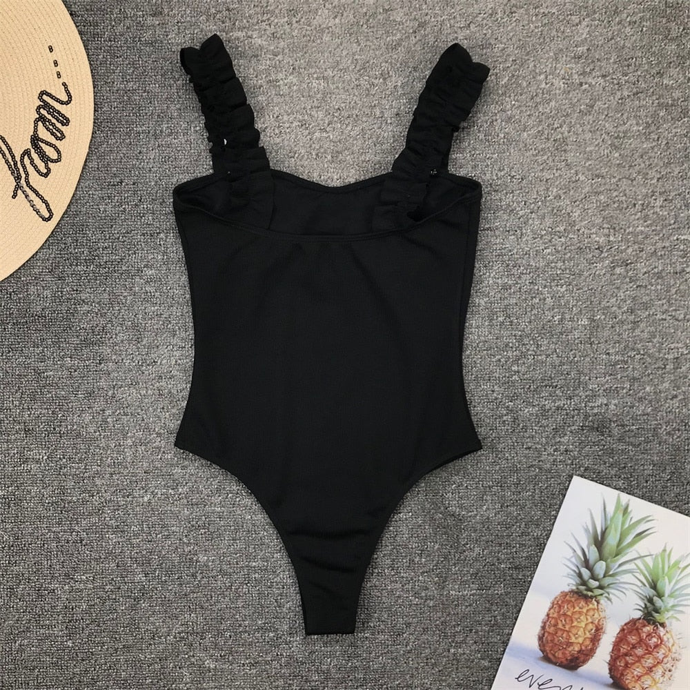 Vintage one-piece ruffled push-up solid swimwear by The Clothing Company Sydney, featuring padded monokini bathing suit with stylish ruffles.
