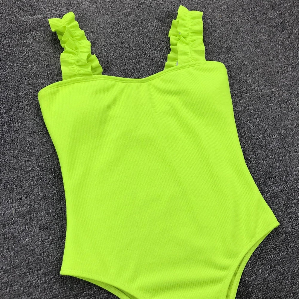 Vintage one-piece swimsuit by The Clothing Company Sydney with ruffled design, push-up padding, solid color, and stylish monokini fit.