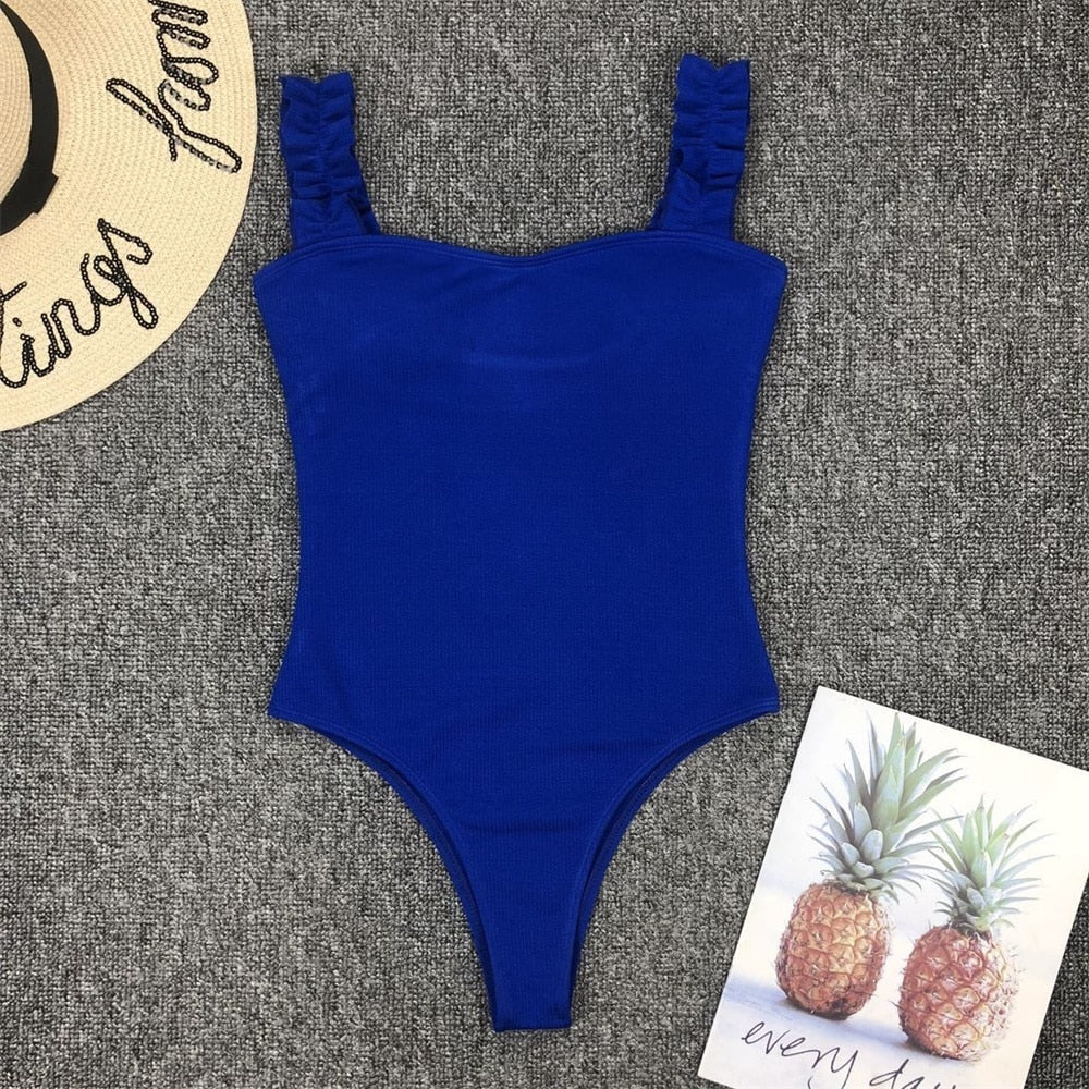 Vintage one-piece ruffled swimwear by The Clothing Company Sydney featuring push-up padding, solid color, and stylish monokini design.