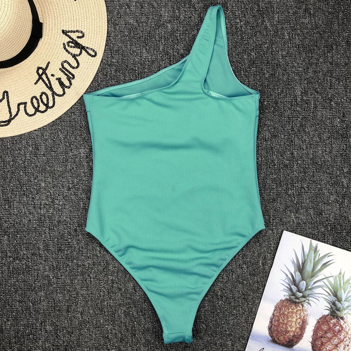 Vintage one-piece ruffled push-up swimsuit by The Clothing Company Sydney featuring solid color, padded design, and elegant monokini style.