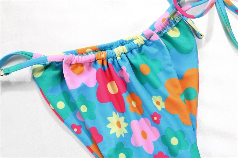 Solid color bikini set with floral print, string design, from The Clothing Company Sydney, perfect for swimming and beachwear.