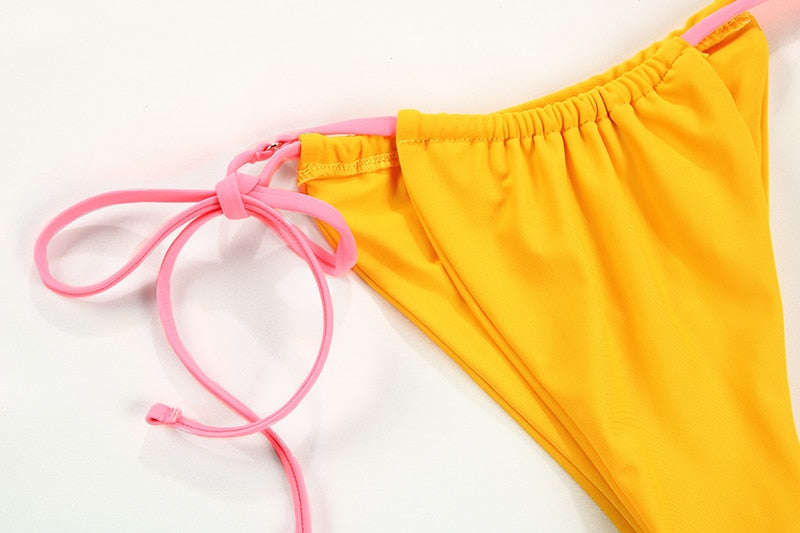 Solid color bikini set with floral print, string swimsuit from The Clothing Company Sydney, perfect for beach and pool moments.