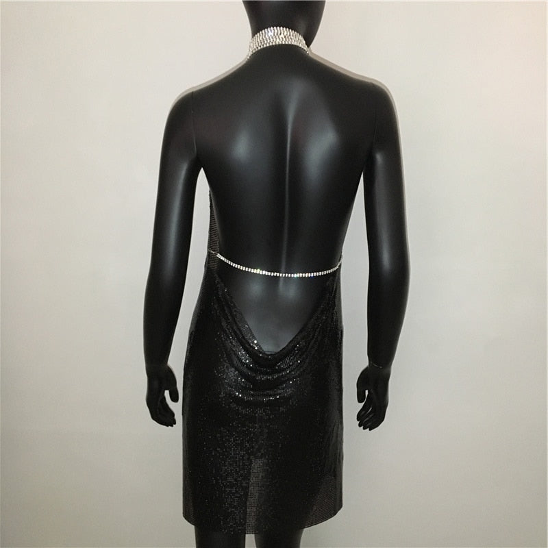 Deep V-neck halter split sequined dress for women, backless with rhinestone chain, metal accents, perfect for party or evening wear.