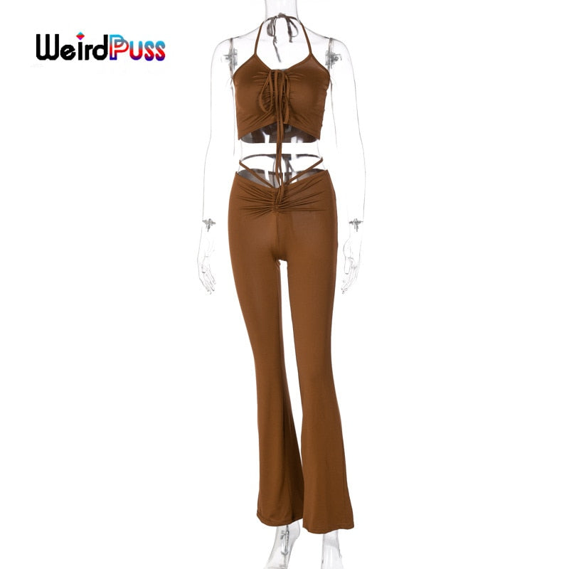 Stretchy black sweatpants from The Clothing Company Sydney, matching sleeveless ruched halter tops, perfect for clubwear.
