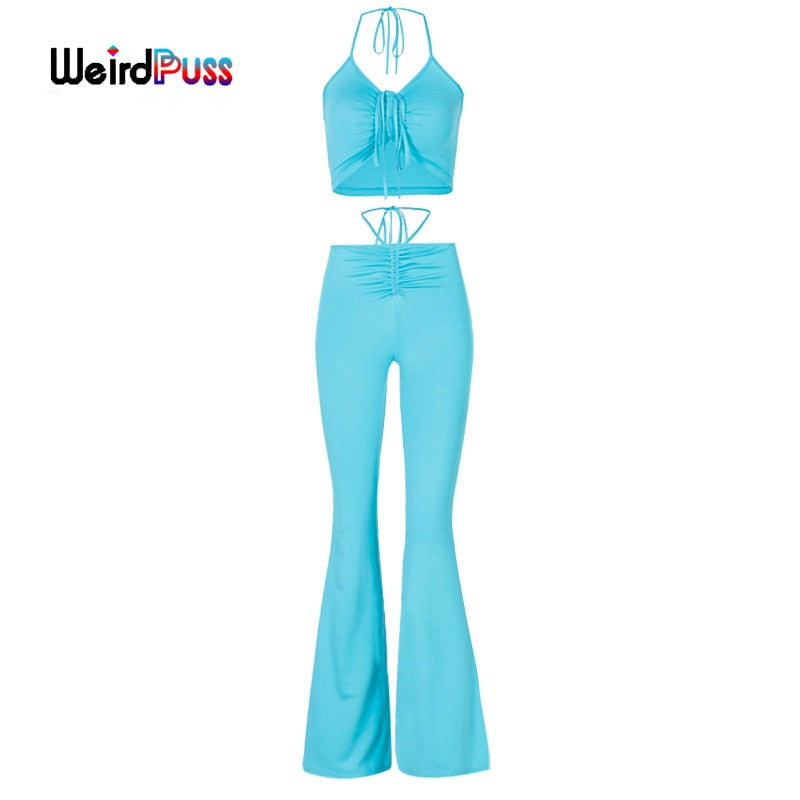 Stretchy black sweatpants from The Clothing Company Sydney with a slim fit, paired with halter bandage v-neck sleeveless ruched tops.