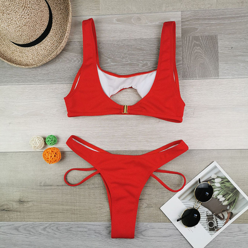 Hollow out high cut swimsuit by The Clothing Company Sydney, solid color bikini set with stylish beachwear design.
