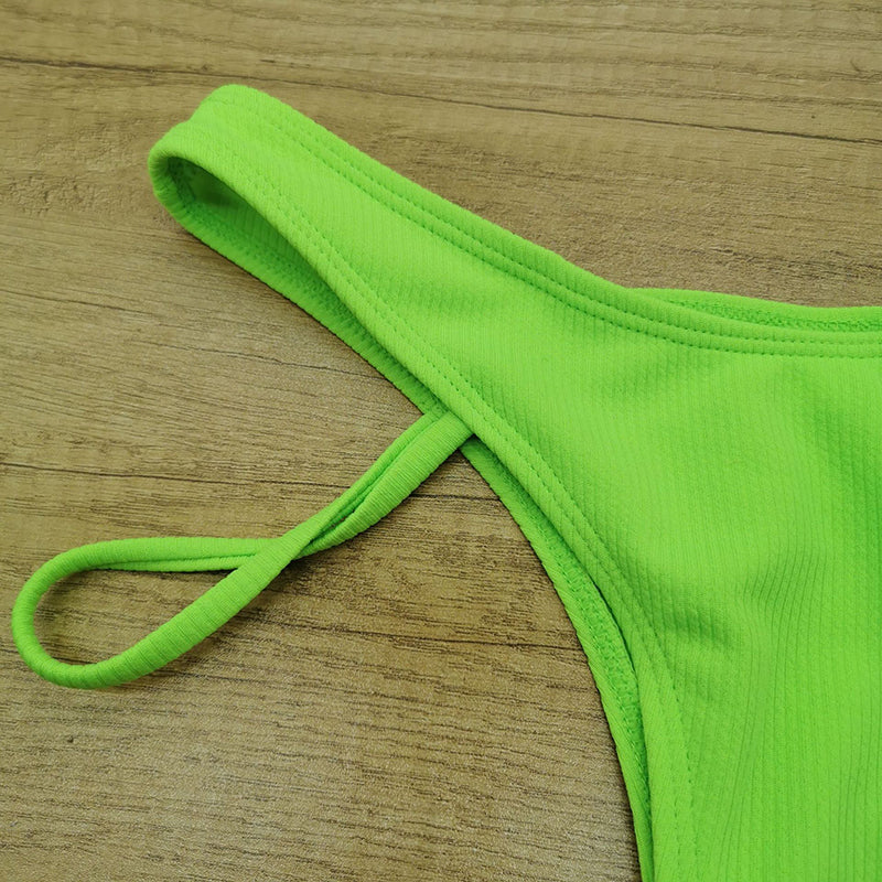 Hollow out high cut swimsuit by The Clothing Company Sydney featuring solid color, fashionable design, perfect for beach wear.